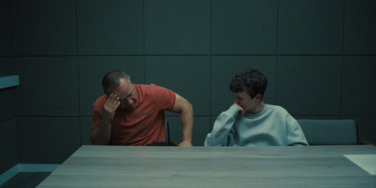 Father and son in police station during interview in TV Show Adolescence